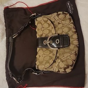 Coach purse with storage bag.